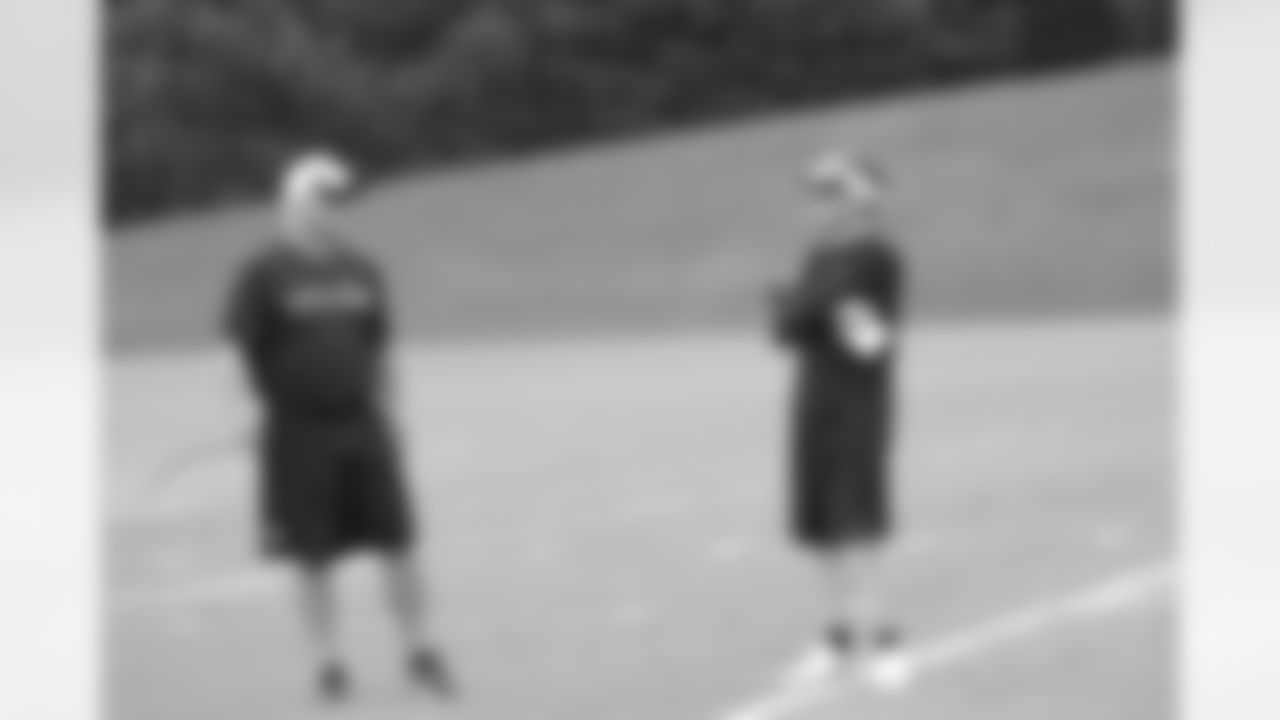 GM Thomas Dimitroff talks to head coach Mike Smith