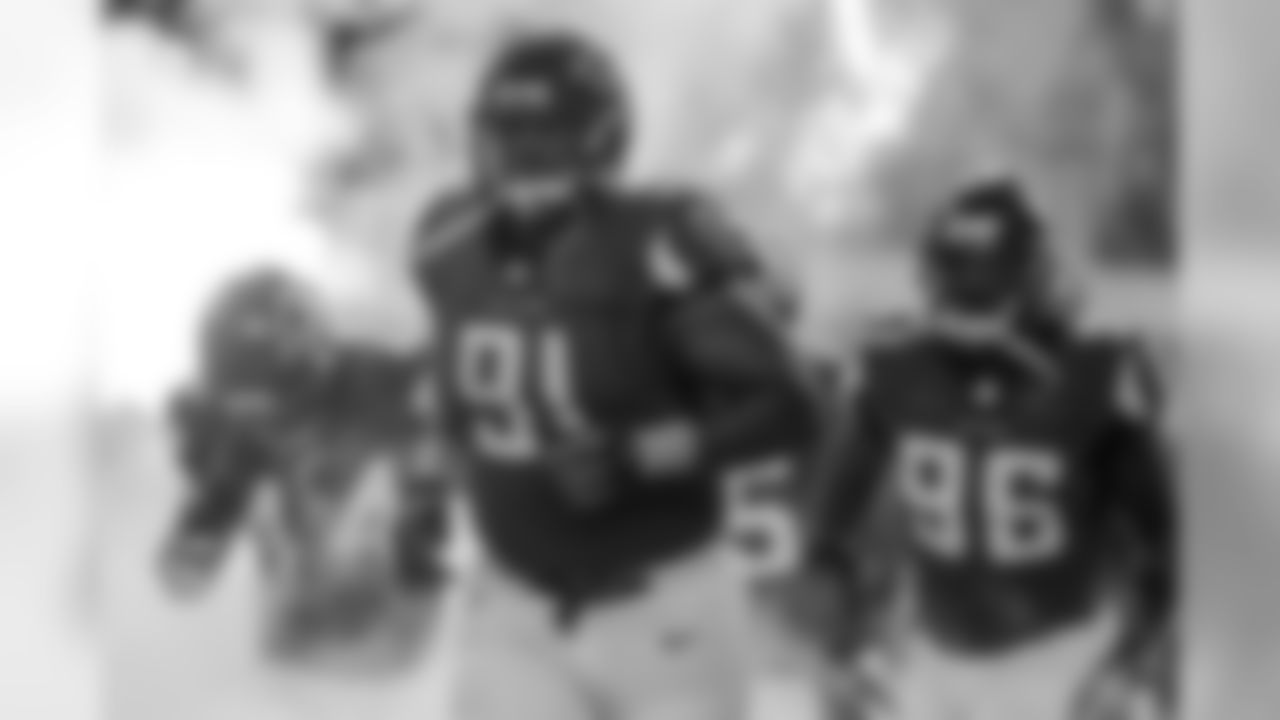 DT Corey Peters leads the defensive line out of the tunnel.