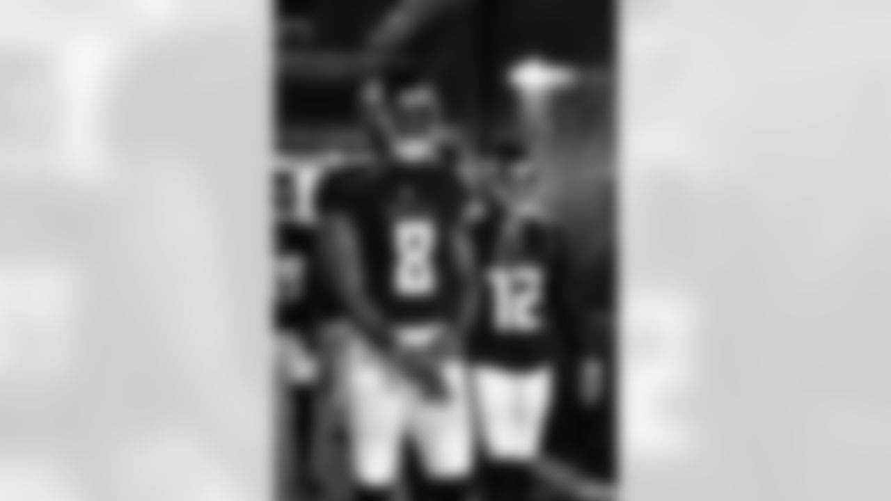 Atlanta Falcons tight end Kyle Pitts #8 and wide receiver KhaDarel Hodge #12 walk out to warmups before the game against the New Orleans Saints at Mercedes-Benz Stadium in Atlanta, Georgia on Sunday, September 11, 2022. (Photo by Kyle Hess/Atlanta Falcons)