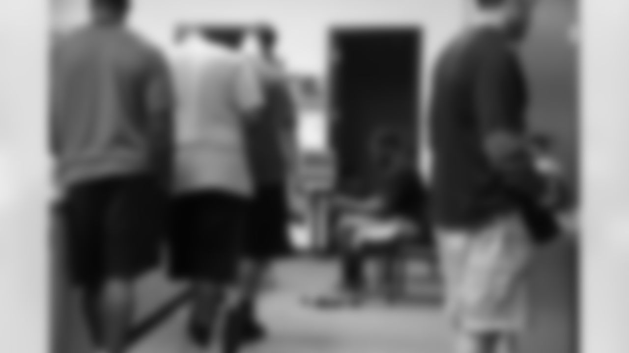Rookies stand in line to get fitted for equipment // 2012 Rookies Report // May 10, 2012 // Flowery Branch -