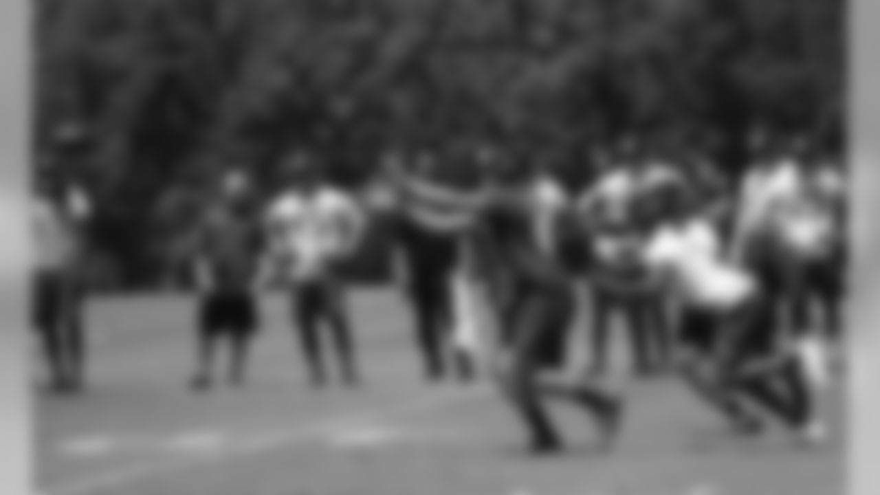 Austin Hooper gets in front of two defenders to haul in a pass during 7-on-7s
