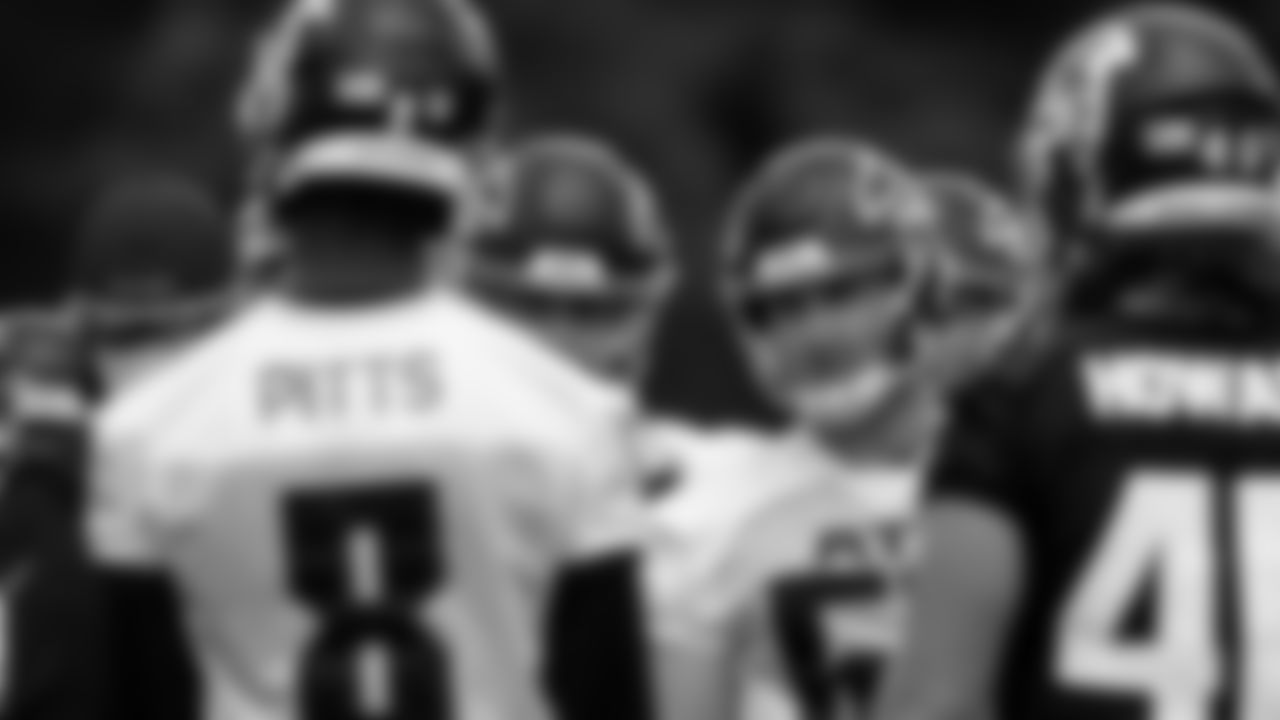 Atlanta Falcons offensive lineman Drew Dalman #67 looks on from the huddle during the first practice of Atlanta Falcons rookie minicamp on May 14, 2021.