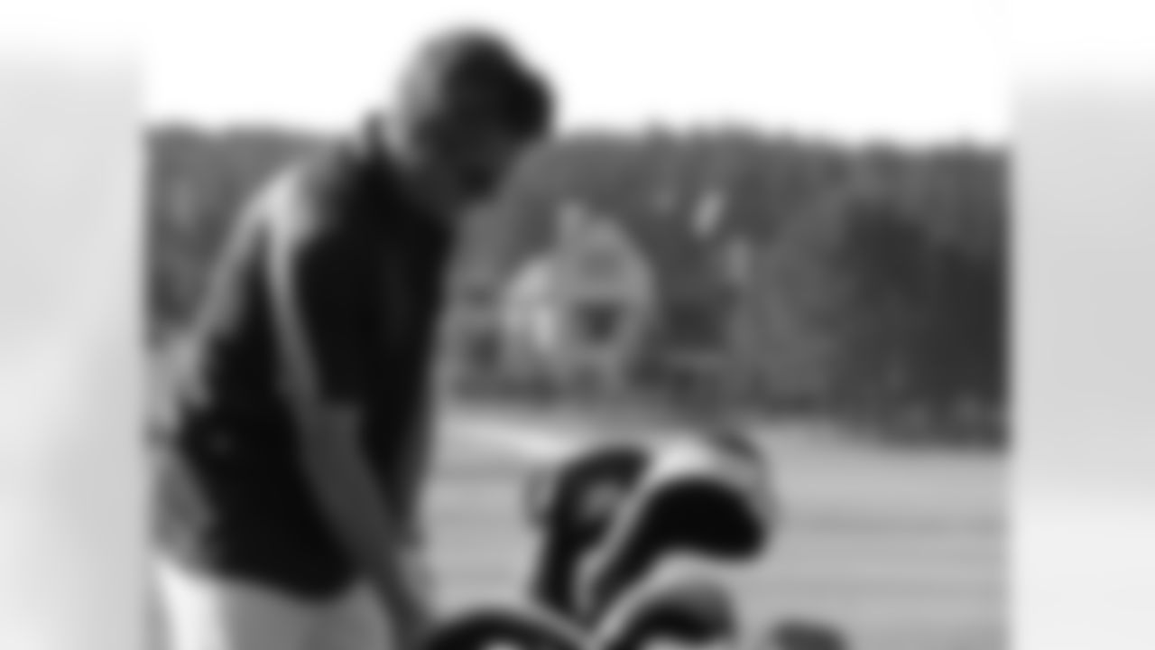 Falcons GM Thomas Dimitroff warms up on the range // Seventh Annual Verizon Network of Champions Golf Tournament // 6/13/11 // Suwanee, Ga. -