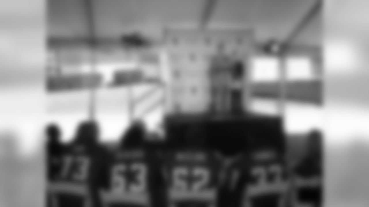 Players look on as Centennial Place YMCA is renamed in honor of team honor