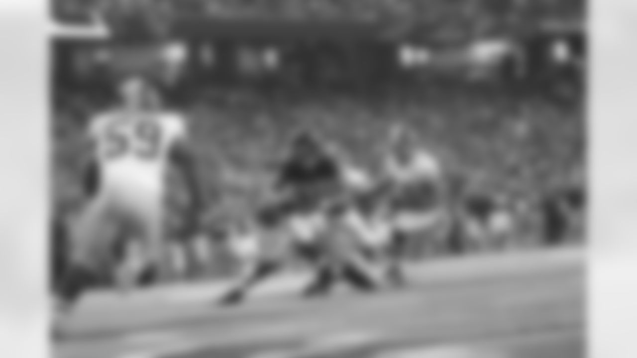 TE Tony Gonzalez keeps his eyes on the end zone as he is tackled just short of the goal line