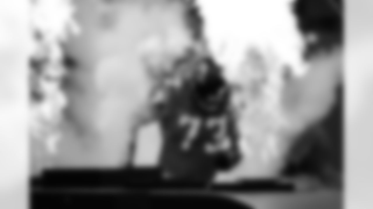 Tackle Ryan Schraeder is a man on fire as he exits the player tunnel