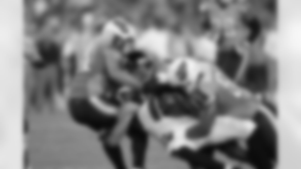 WR Kevin Cone is brought down with the ball
