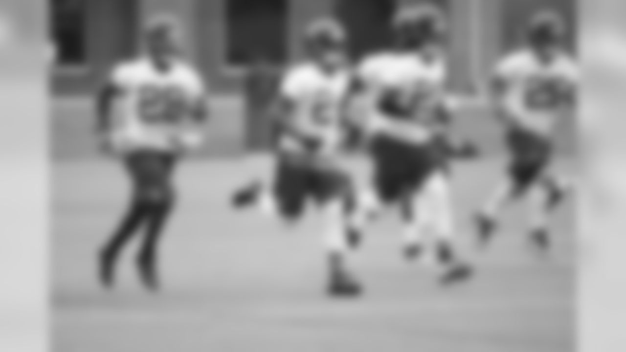 The defensive backs warm up on day two of minicamp