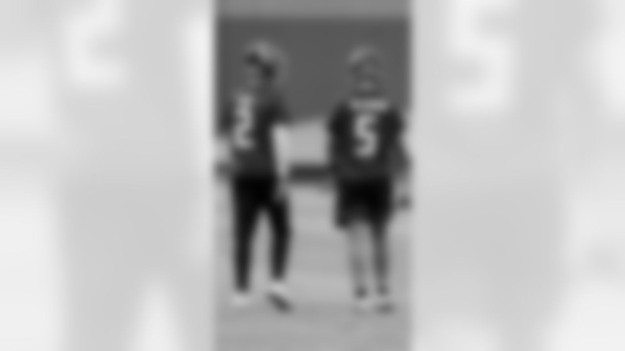 Atlanta Falcons quarterback Matt Ryan #2 walks with quarterback AJ McCarron #5 during organized team activities in Phase III of the Atlanta Falcons offseason program on June 2, 2021.