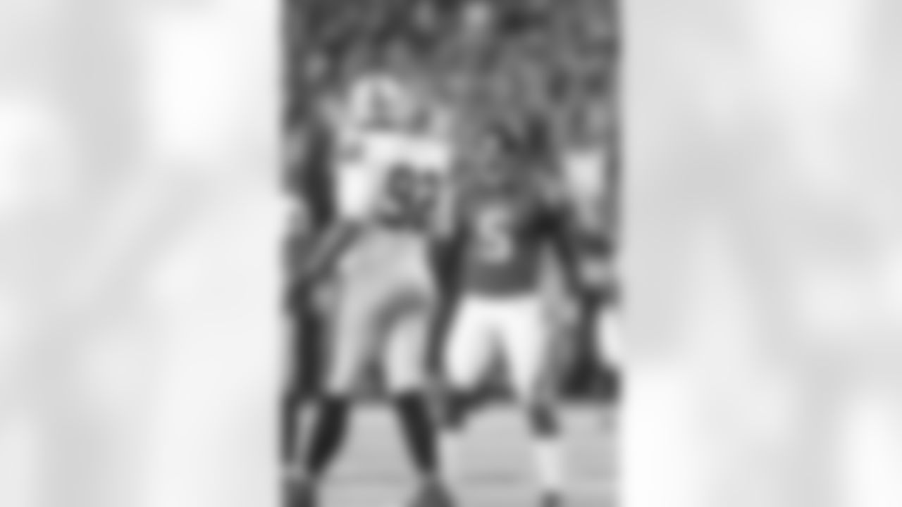 Punter Matt Bosher gives Oakland's Richard Seymour an earful.
