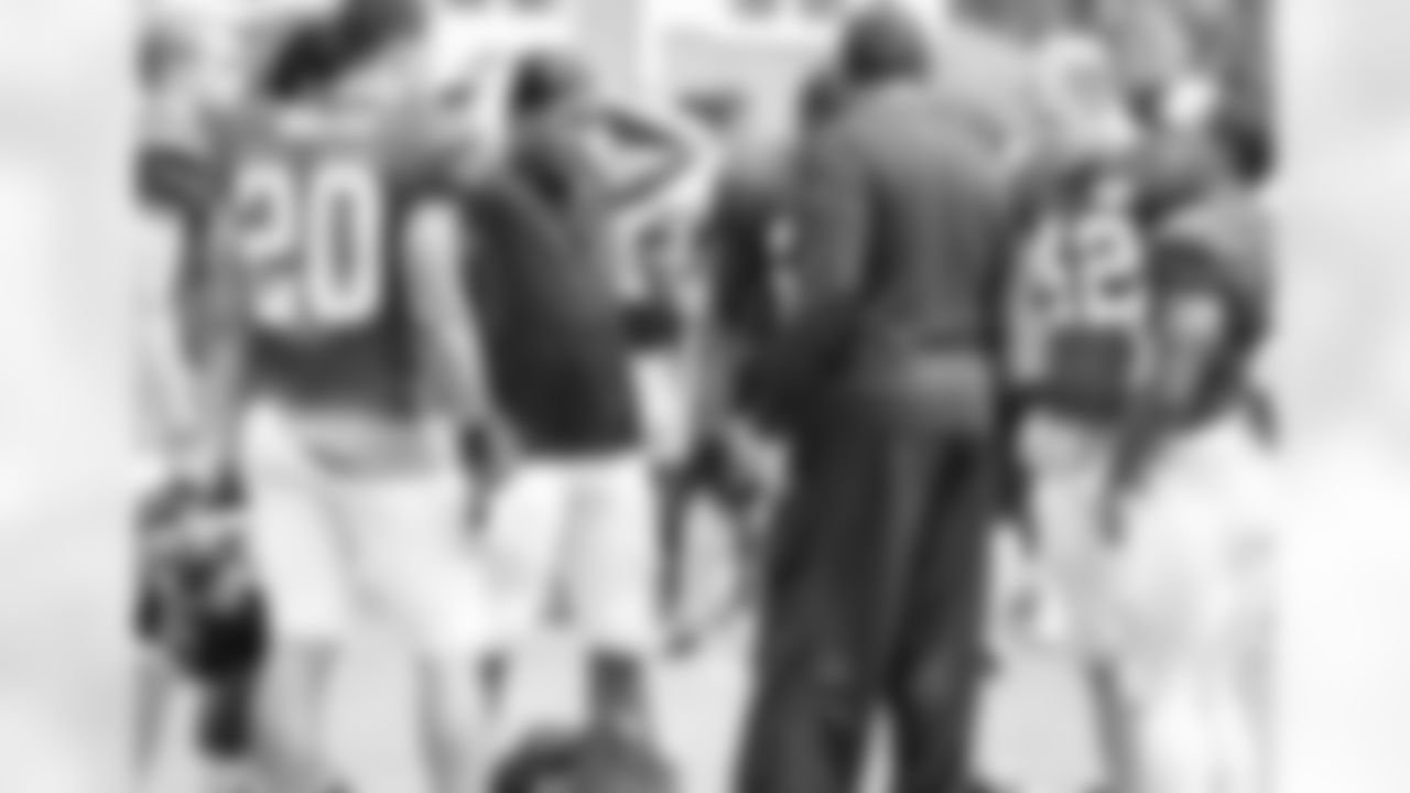 Running backs coach, Bobby Turner, talks to his group