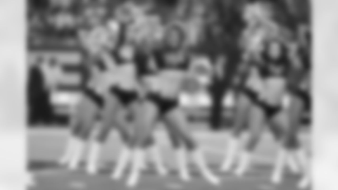 The Atlanta Falcons Cheerleaders perform on the field before the Falcons vs. Cowboys game begins