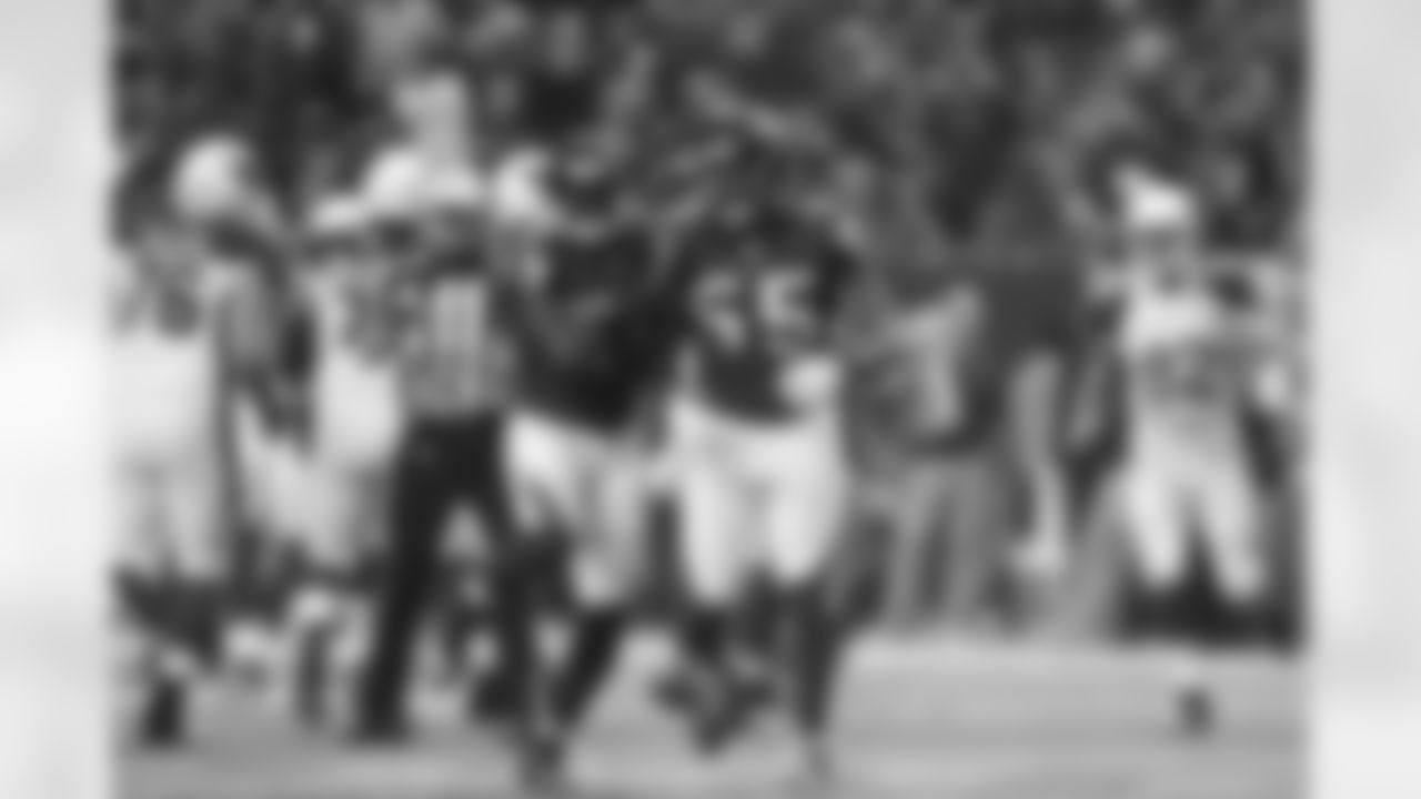 LB Stephen Nicholas celebrates after DE John Abraham's sack
