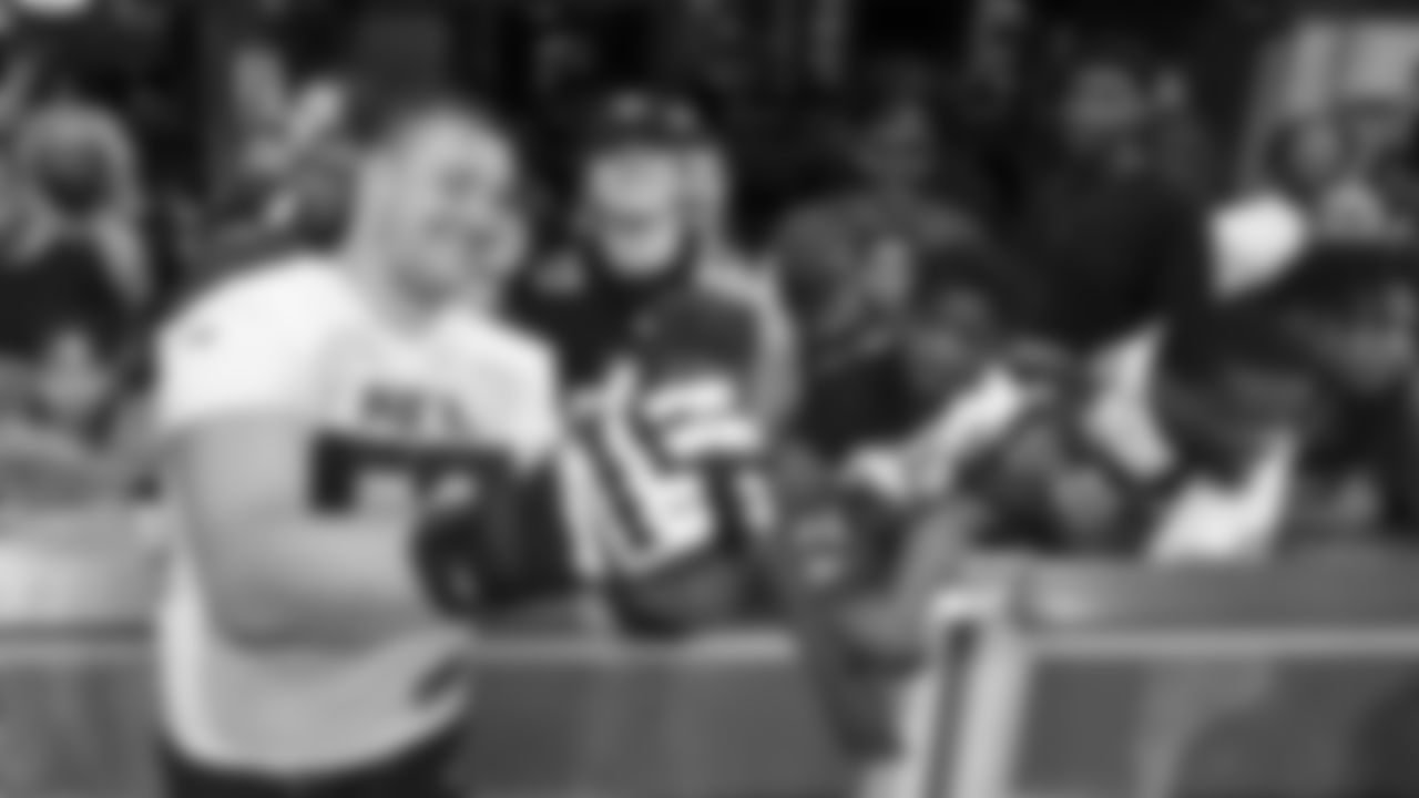 Atlanta Falcons guard Chris Lindstrom #63 interacts with fans during the First Look open practice at Mercedes-Benz Stadium in Atlanta, Georgia, on Friday, June 2, 2023. (Photo by Jay Bendlin/Atlanta Falcons)