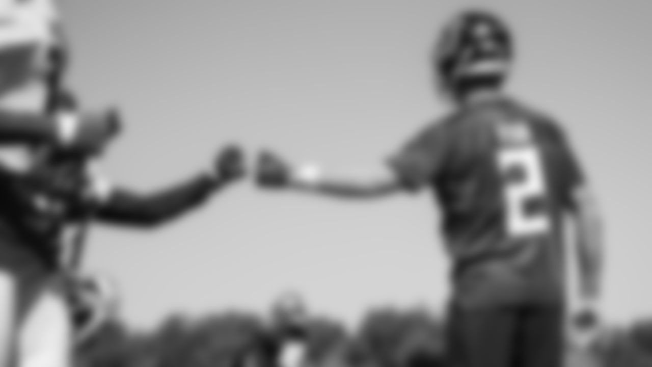 Atlanta Falcons quarterback Matt Ryan #2 gives a fist bump during practice at IBM Performance Field. (Photo by Kara Durrette/Atlanta Falcons)