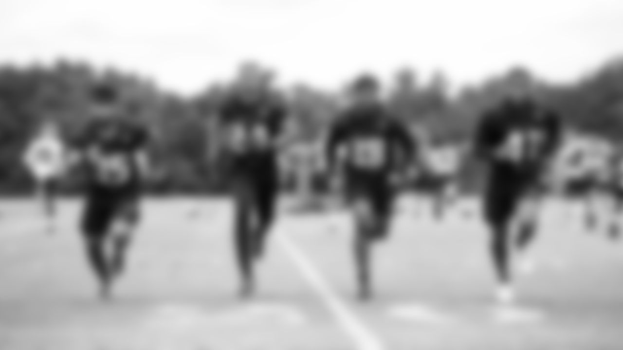 Defensive backs run during organized team activities in Phase III of the Atlanta Falcons offseason program on June 2, 2021.