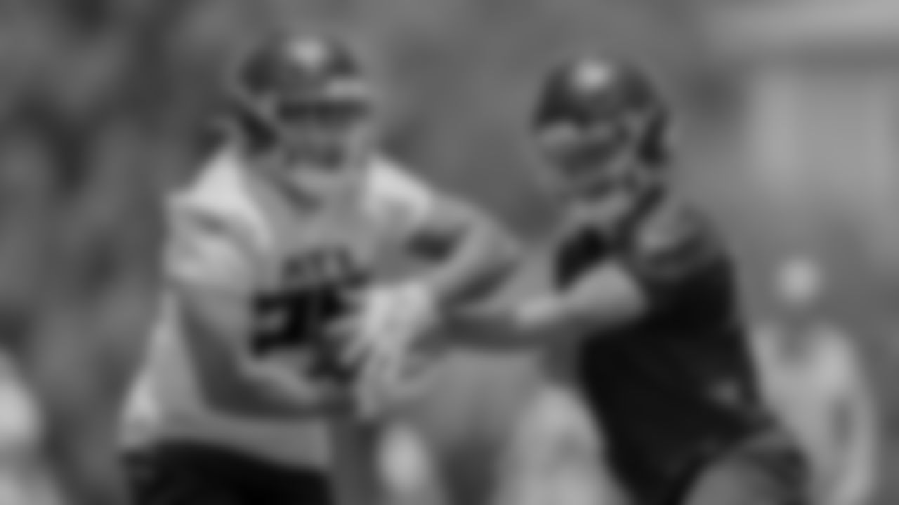 Atlanta Falcons quarterback Desmond Ridder #9 hands off the ball to running back Tyler Allgeier #25 during OTA practice at Atlanta Falcons Headquarters in Flowery Branch, Georgia, on Thursday, May 25, 2023. (Photo by Jay Bendlin/Atlanta Falcons)