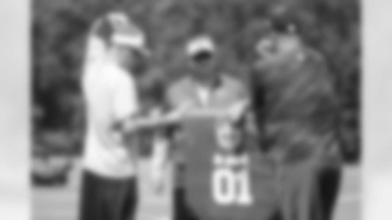 Offensive coordinator, Dirk Koetter, assistant offensive line coach, Wade Harman, and offensive line coach, Mike Tice, talk before practice