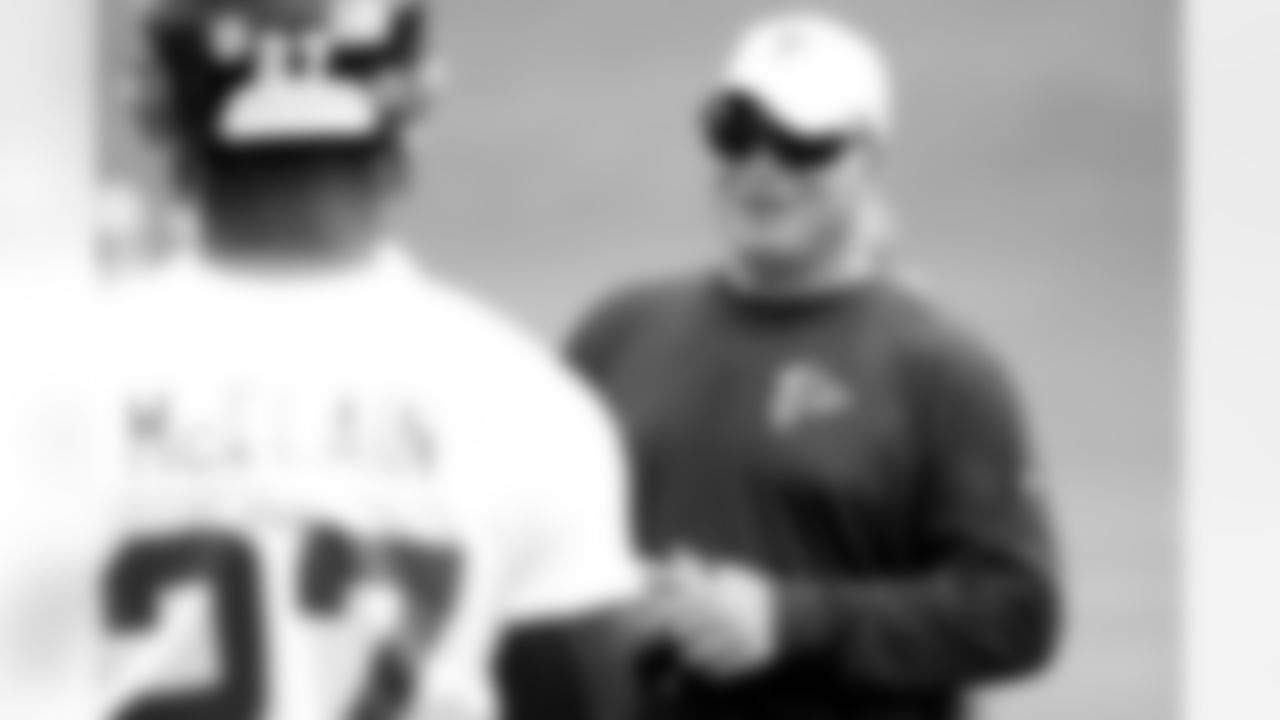 Head coach Mike Smith talks to CB Robert McClain