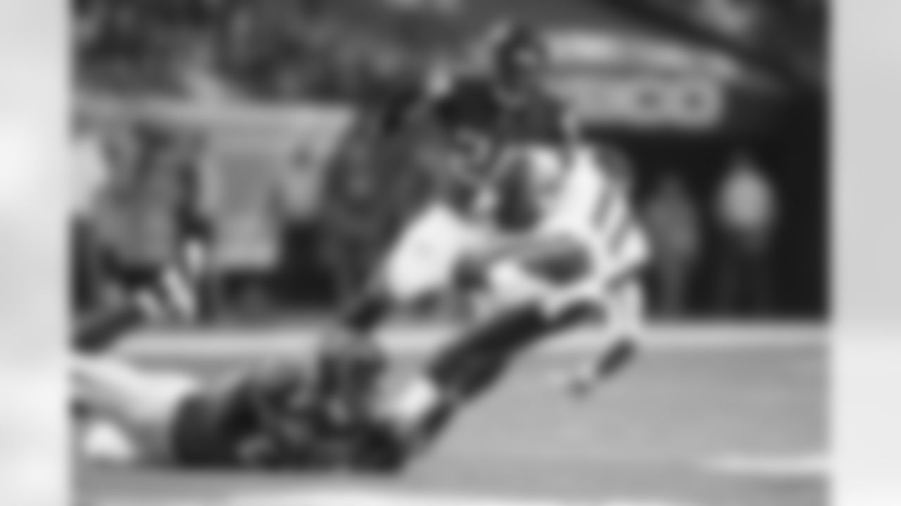 CB Robert McClain grabs the shoestrings to bring Rams WR Tavon Austin down