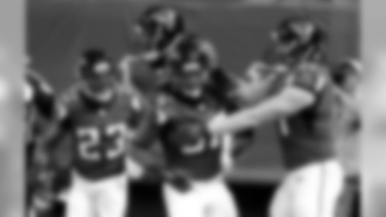 S Kemal Ishmael celebrates his pick six with teammates