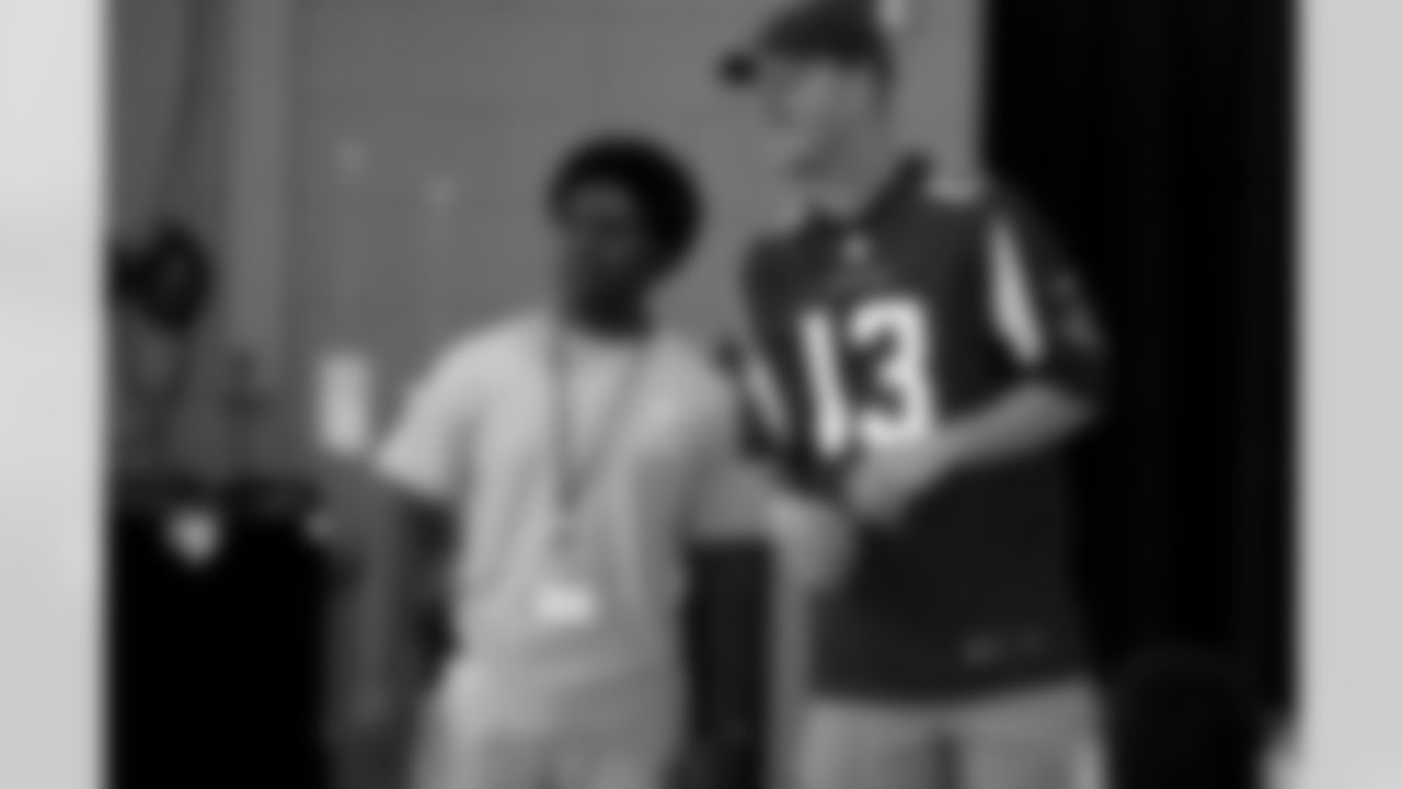 QB T.J. Yates takes a photo with one of the group leaders