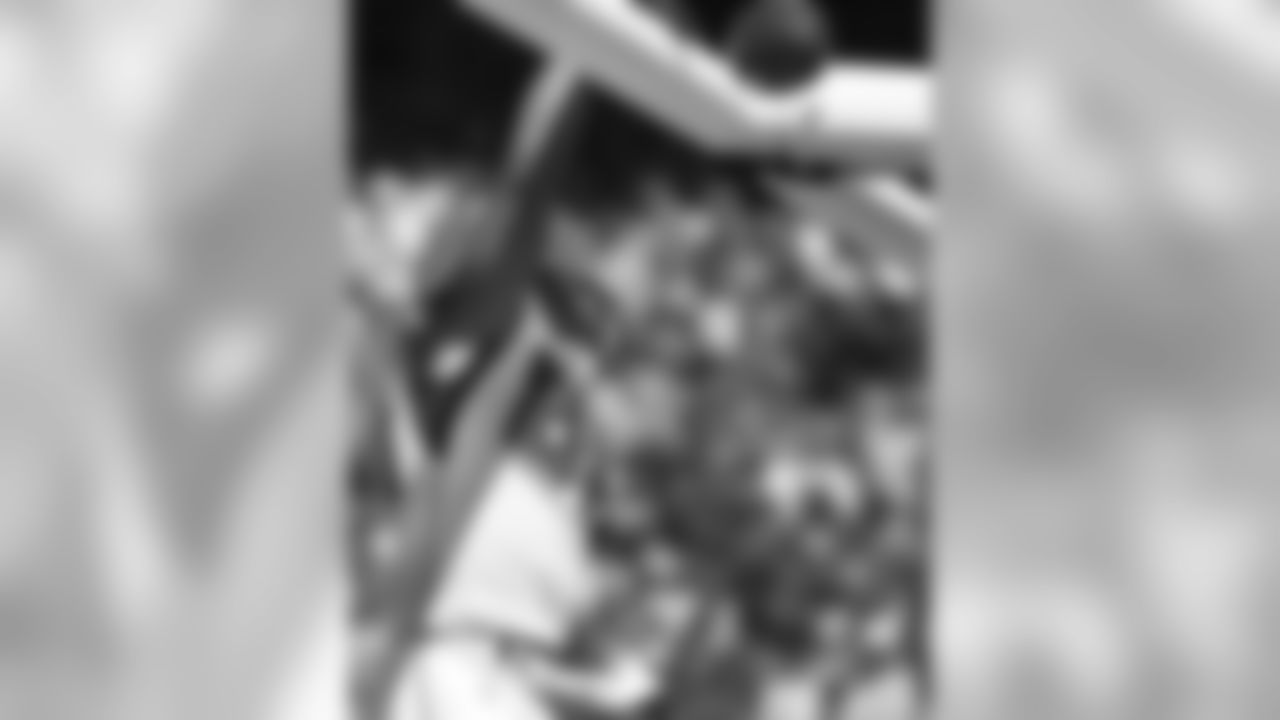 After making a reception for a touchdown against the Chiefs on Sept. 9, 2012, Tony Gonzalez dunks the ball over the goalpost.