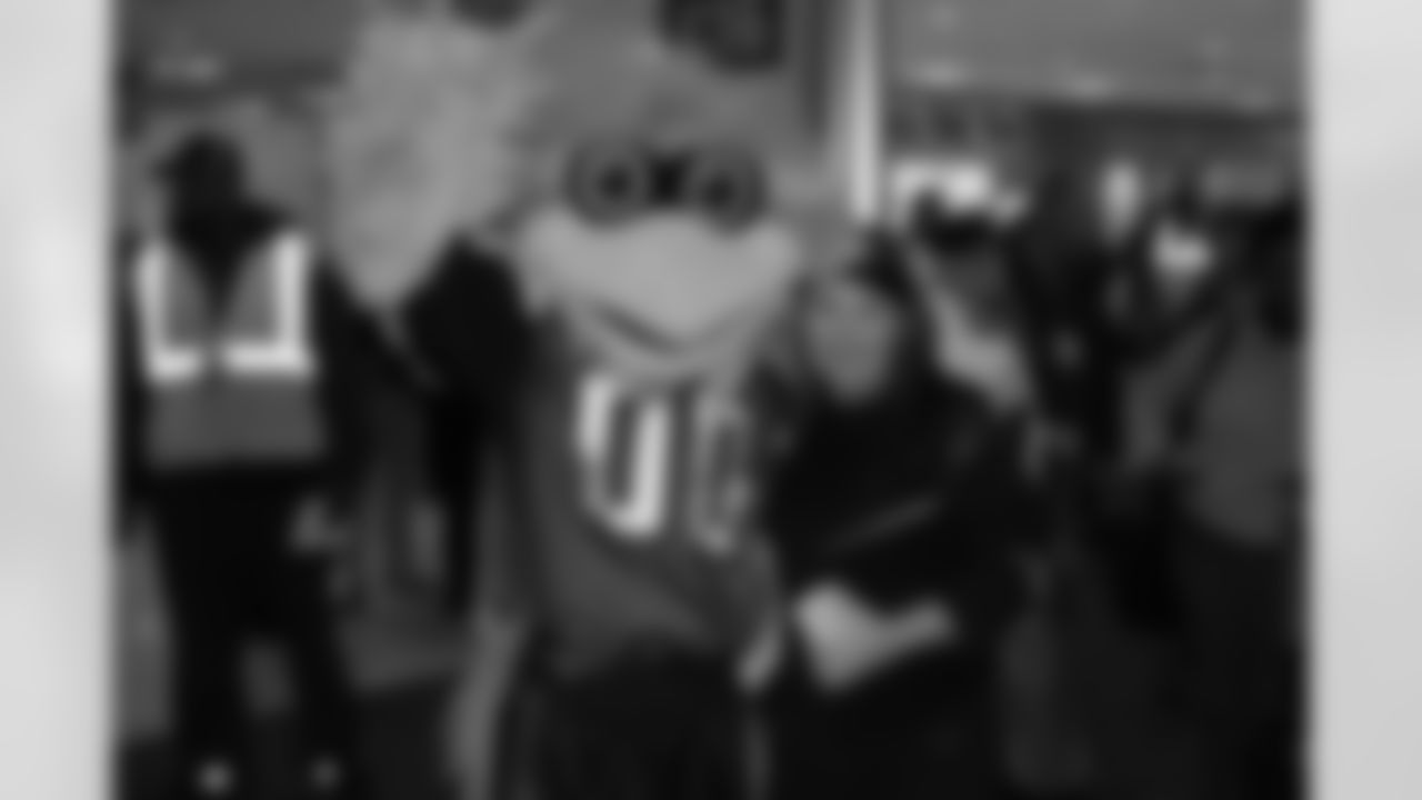Several Falcons traded places with AirTran workers to marshal planes, take tickets and greet passengers // Trading Places - AirTran // Nov. 1, 2011 // Atlanta -