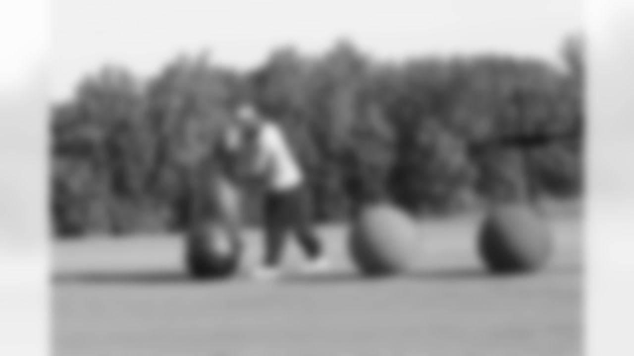 Defensive line coach Ray Hamilton sets up a drill // 2011 Russell Athletic Training Camp - Day 11 // August 11, 2011 // Flowery Branch, Ga. —