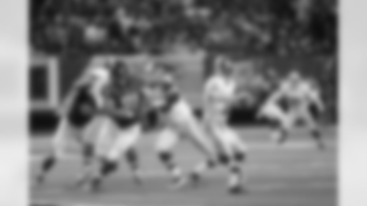 DT Corey Peters gets past the Redskins offensive line and heads for Redskins QB Kirk Cousins