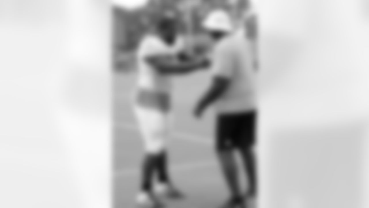 DT Theo Agnew works with defensive line coach Bryan Cox