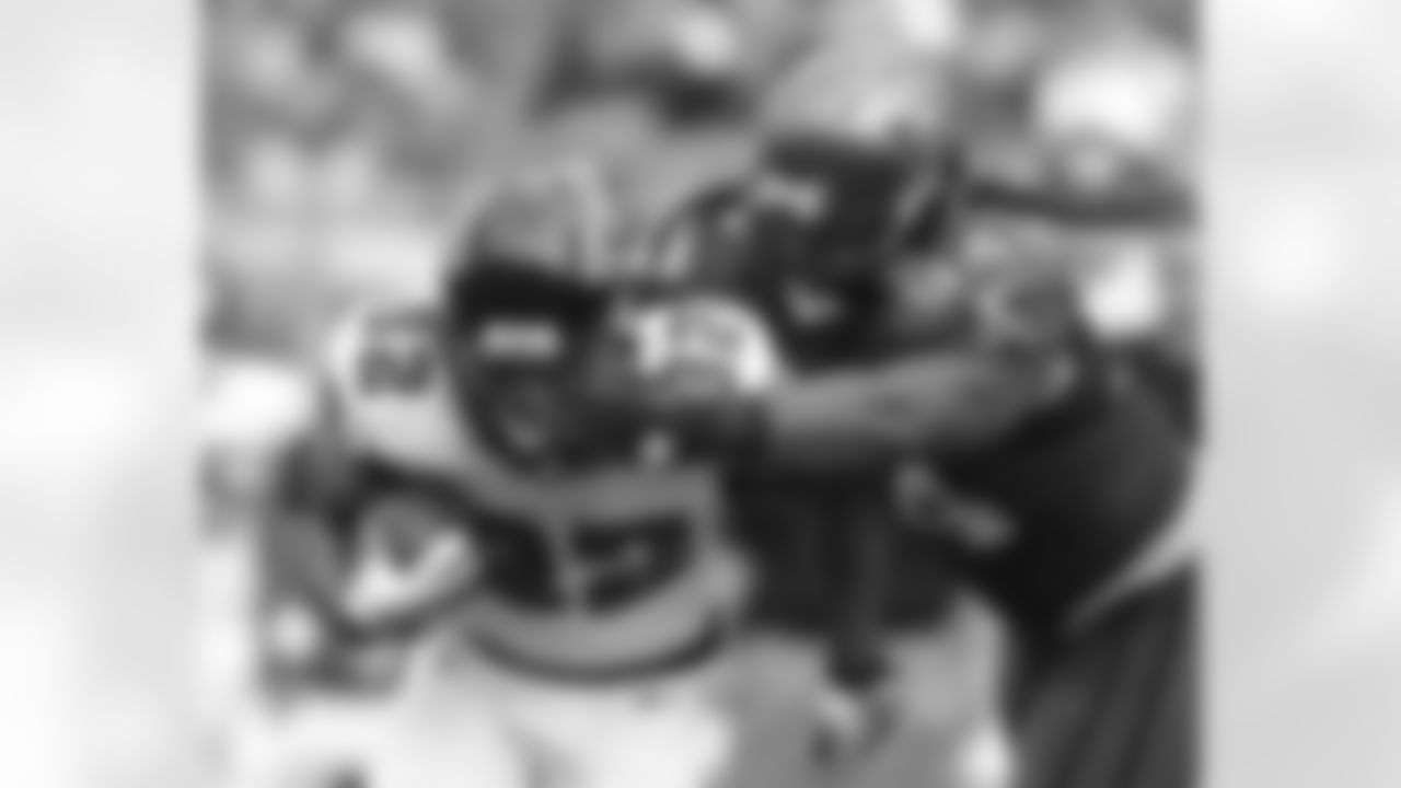 RB Jacquizz Rodgers battles against Buccaneers DE Adrian Clayborn