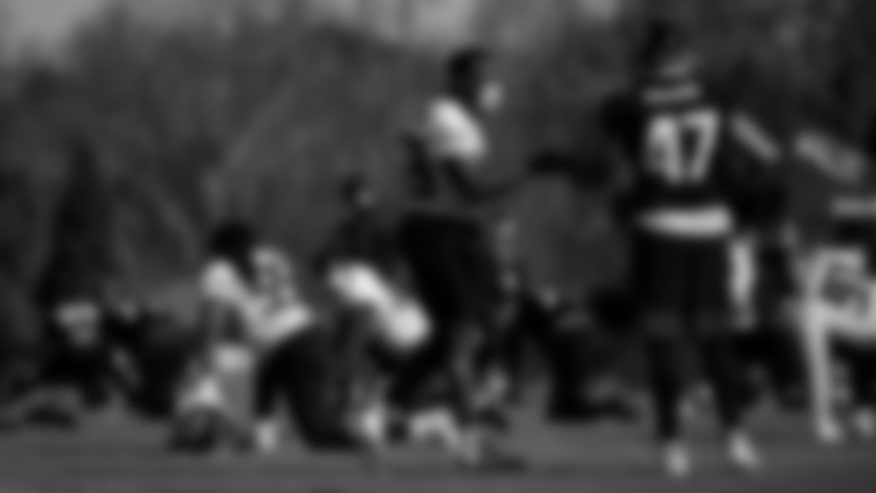Atlanta Falcons linebacker LaRoy Reynolds #59 fist bumps long snapper Josh Harris #47 during practice at IBM Performance Field.
