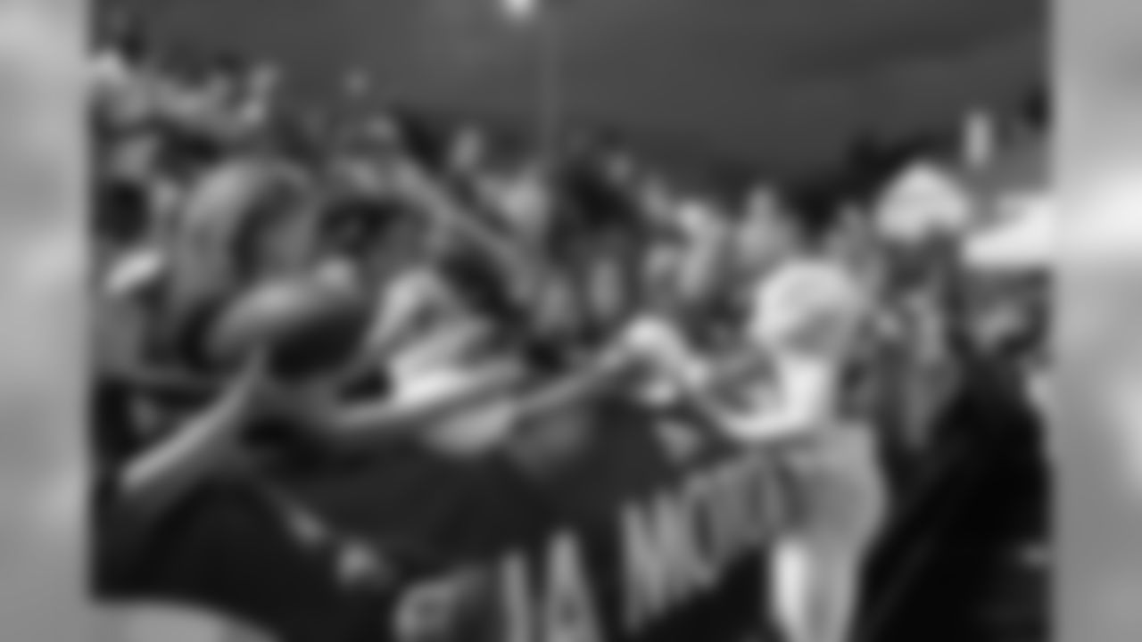 After signing his new contract yesterday, Pro Bowl CB Brent Grimes continues to sign for fans // 2011 Friday Night Lights // August 5, 2011 // Norcross, Ga. —