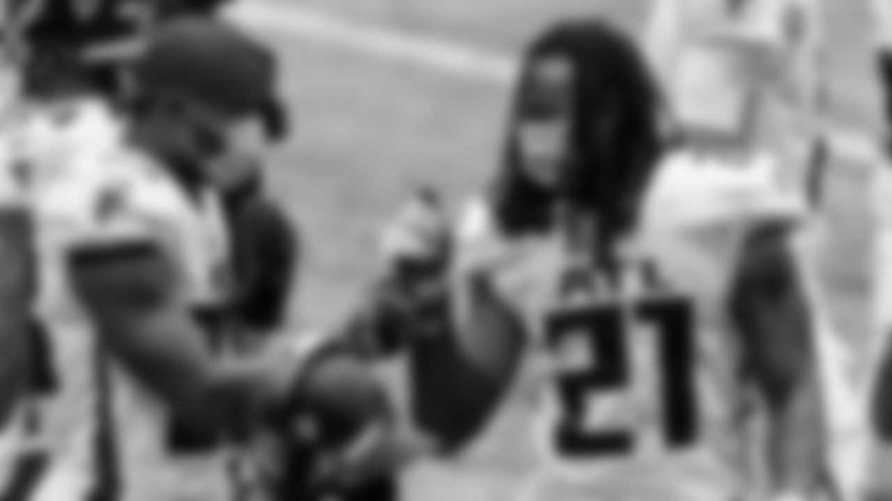 Atlanta Falcons running back Brian Hill #23 fist bumps running back Todd Gurley #21 during the game against the Denver Broncos on November 8, 2020. (Photo by Adam Hagy/Atlanta Falcons)