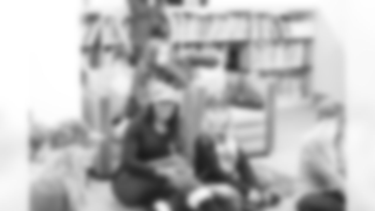 Denita C. sits with one of the military children in Alaska