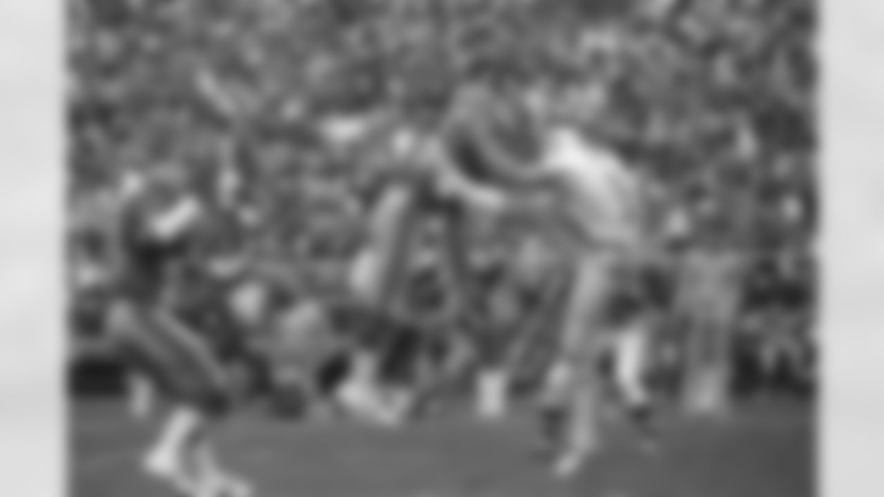 Atlanta Falcons cornerback Bob Glazebrook sails into the leg of Detroit Lions kicker Tom Skladany (15) after blocking a first period punt at Atlanta Fulton County Stadium on Oct. 5, 1980. Falcons Frank Reed picked up the ball and scored. The Falcons defense scored the first two touchdowns in the National Football League game. (AP Photo/CK)