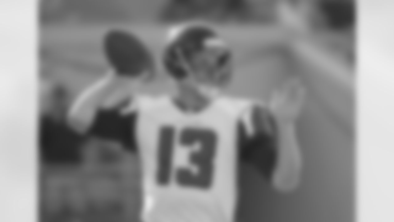 QB T.J. Yates warms up his arm before the game.