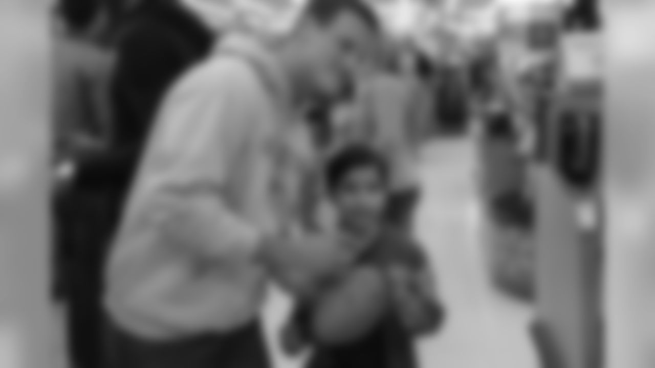 WR Tim Toone poses for photos and signs a few autographs.