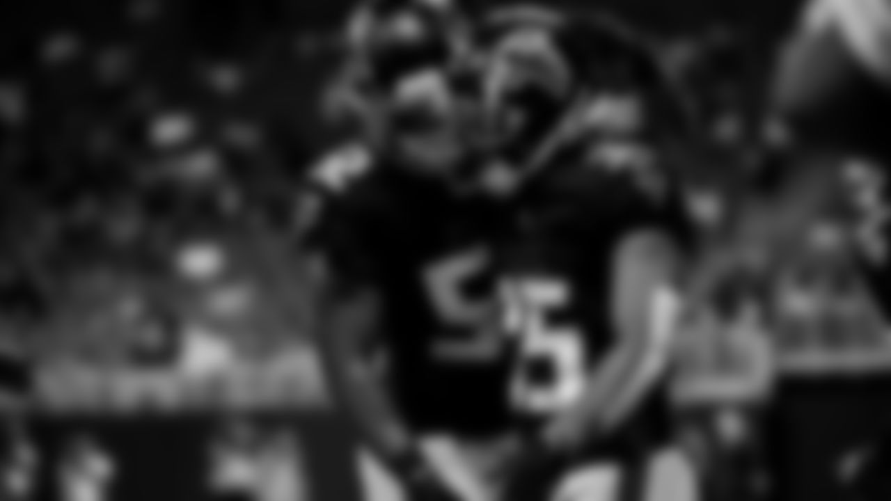 Atlanta Falcons cornerback Avery Williams #35 celebrates with outside linebacker Emmanuel Ellerbee #52 after a play during the Falcon's pre-season game against the Tennessee Titans at Mercedes-Benz Stadium in Atlanta, Georgia on Friday, August 13, 2021. (Photo by Brandon Magnus/Atlanta Falcons)