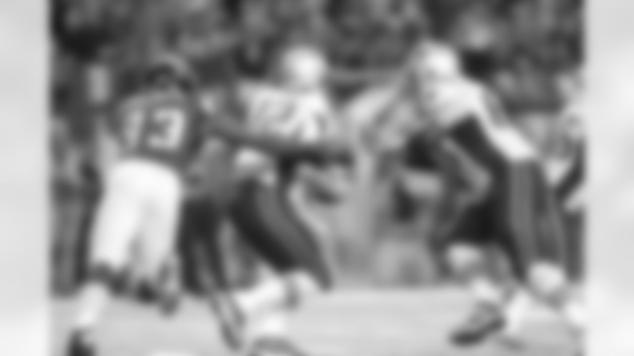 DE Malliciah Goodman gets a hand on Patriots QB Tom Brady