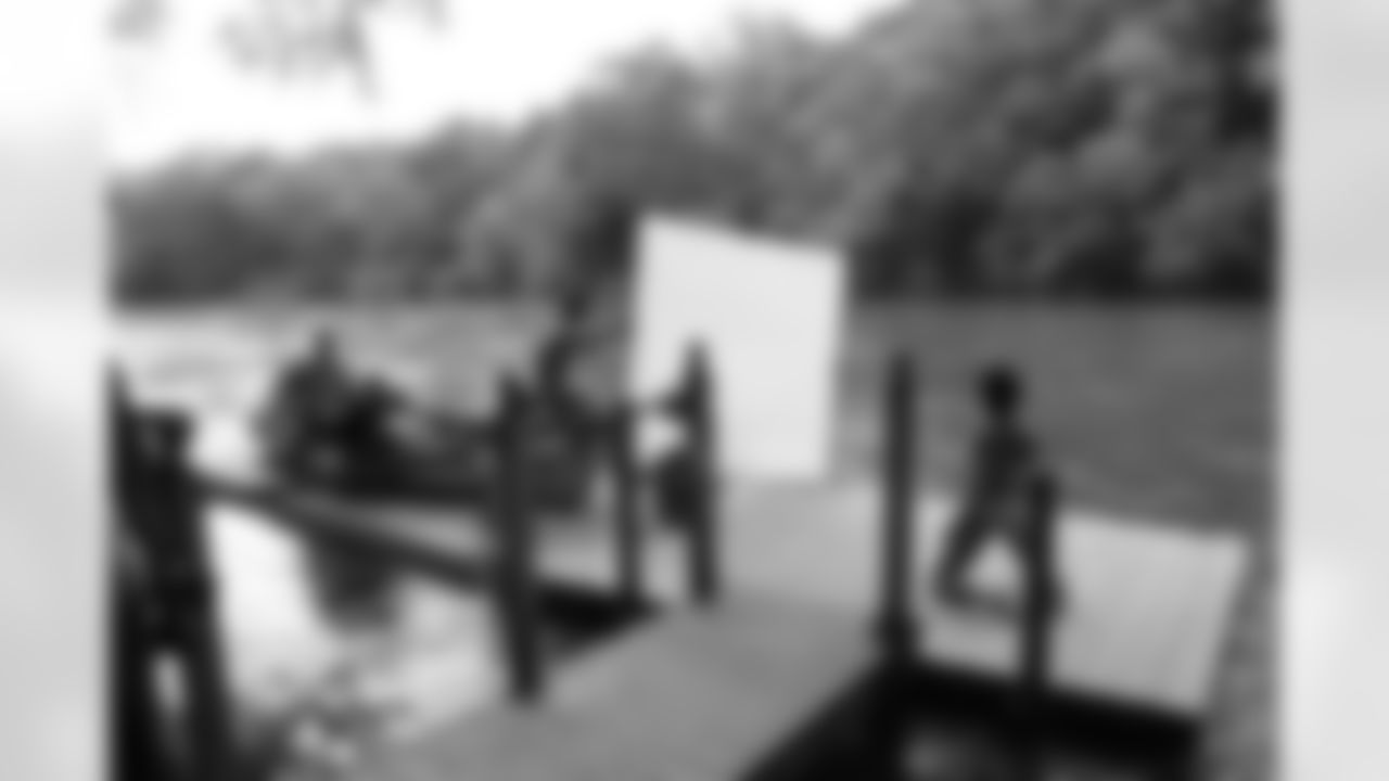 Photographer Joey Wright snaps a few shots of Ashley Y. on a dock