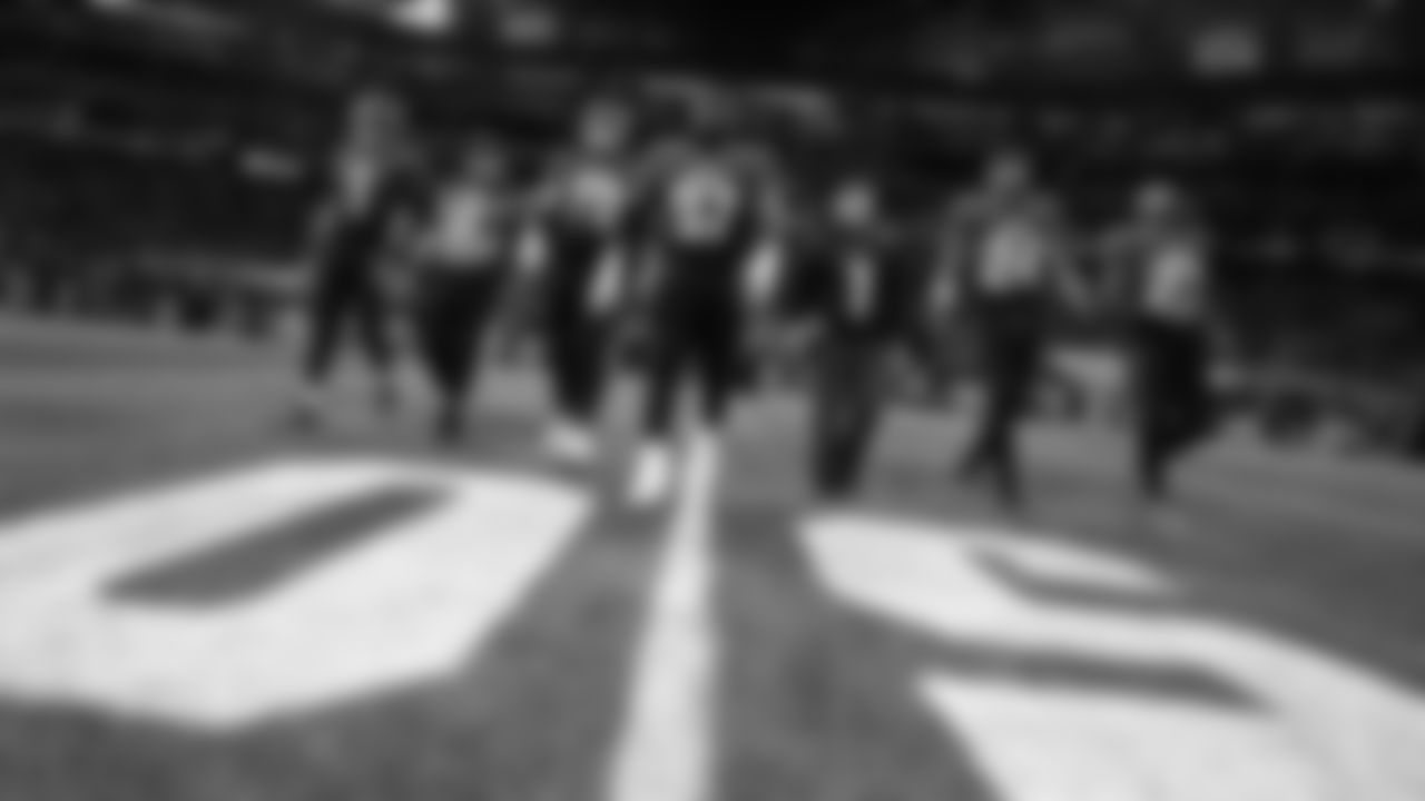 The Atlanta Falcons walk out for the coin toss before the game against the Chicago Bears at Mercedes-Benz Stadium in Atlanta, Georgia on Sunday, November 20, 2022. (Photo by Mitchell Martin/Atlanta Falcons)