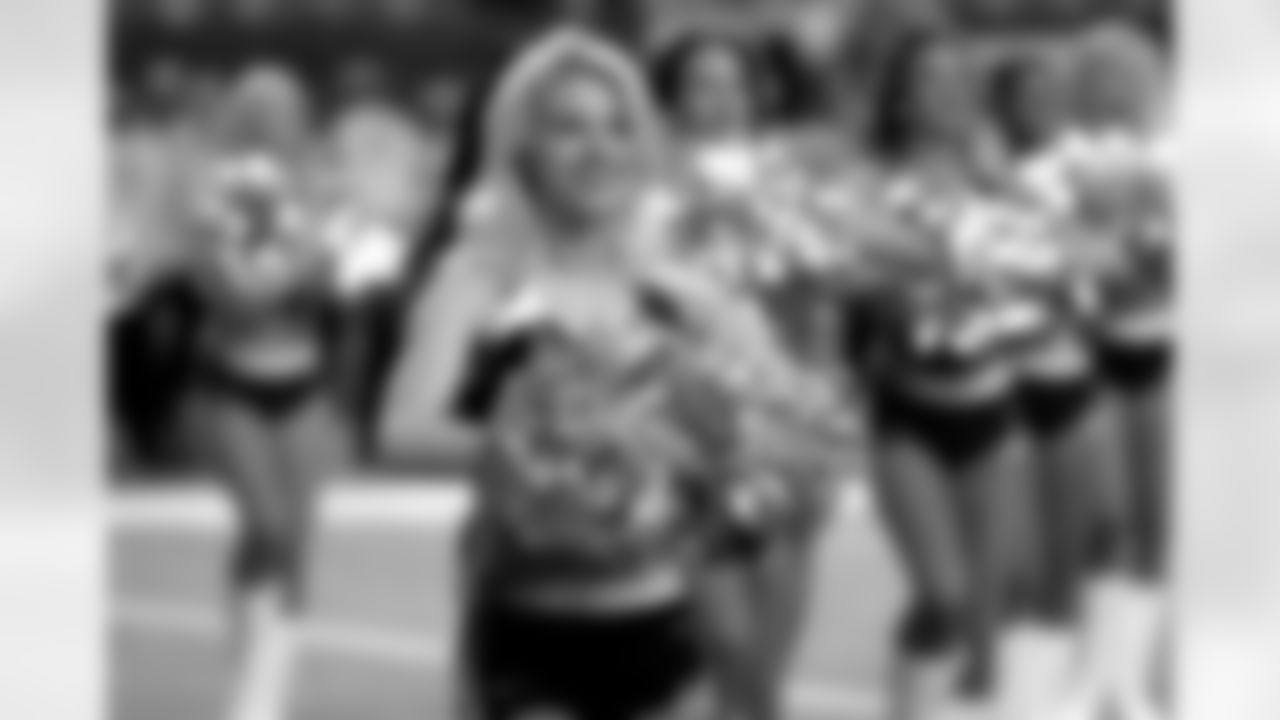 The Atlanta Falcons Cheerleaders warm-up before the game.