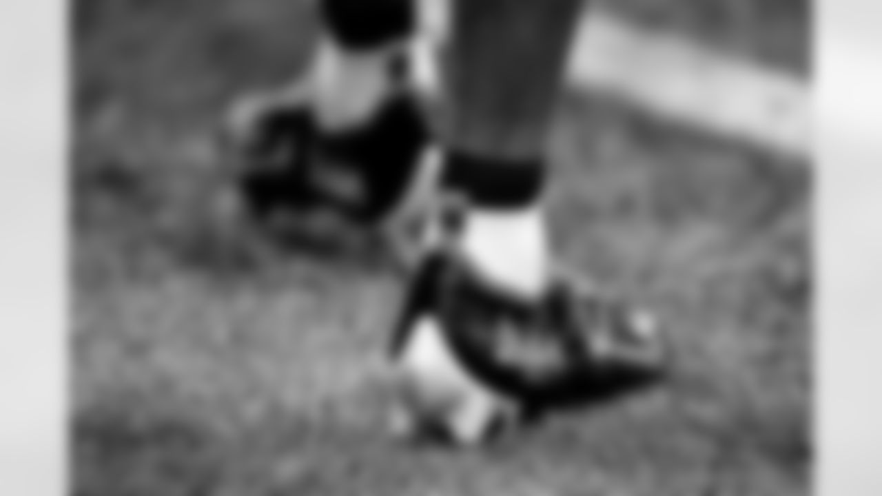 A general view of Darren Hall's cleats during warm ups before the game against the Tampa Bay Buccaneers at Mercedes-Benz Stadium in Atlanta, Georgia on Sunday, December 5, 2021. (Photo by Kyle Hess/Atlanta Falcons)