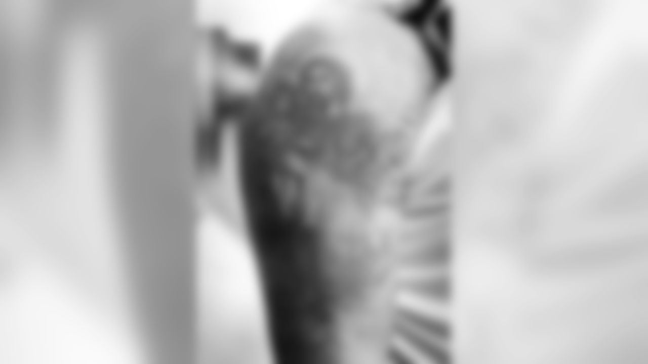 T Jake Long has an impressive set of tattoos, but one has a story that stands out from the rest. Long says when he was a freshmen in college, he was in a house fire and had to be hospitalized with smoke inhalation for a week. His aunt put a card of St. Joseph beneath his pillow and his mom told him to never lose it. He now has St. Joseph tattooed in brilliant color on his right shoulder.