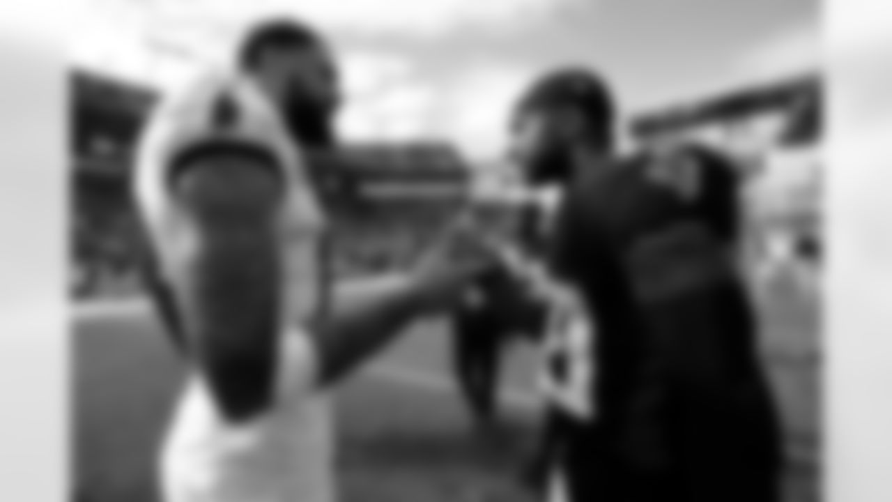 Atlanta Falcons cornerback Casey Hayward #29 talks with Tampa Bay Buccaneers wide receiver Mike Evans #13 after their game at Raymond James Stadium in Tampa, Florida on Sunday, October 9, 2022. (Photo by Doug DeFelice/Atlanta Falcons)