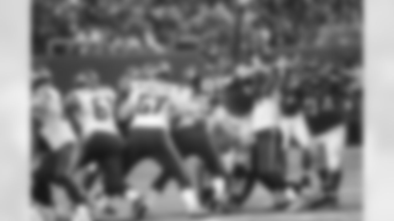 DE Malliciah Goodman and DT Peria Jerry get big to try to block a kick