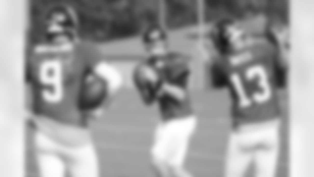 QB Matt Ryan warms up in front of QB Jeff Mathews and QB T.J. Yates