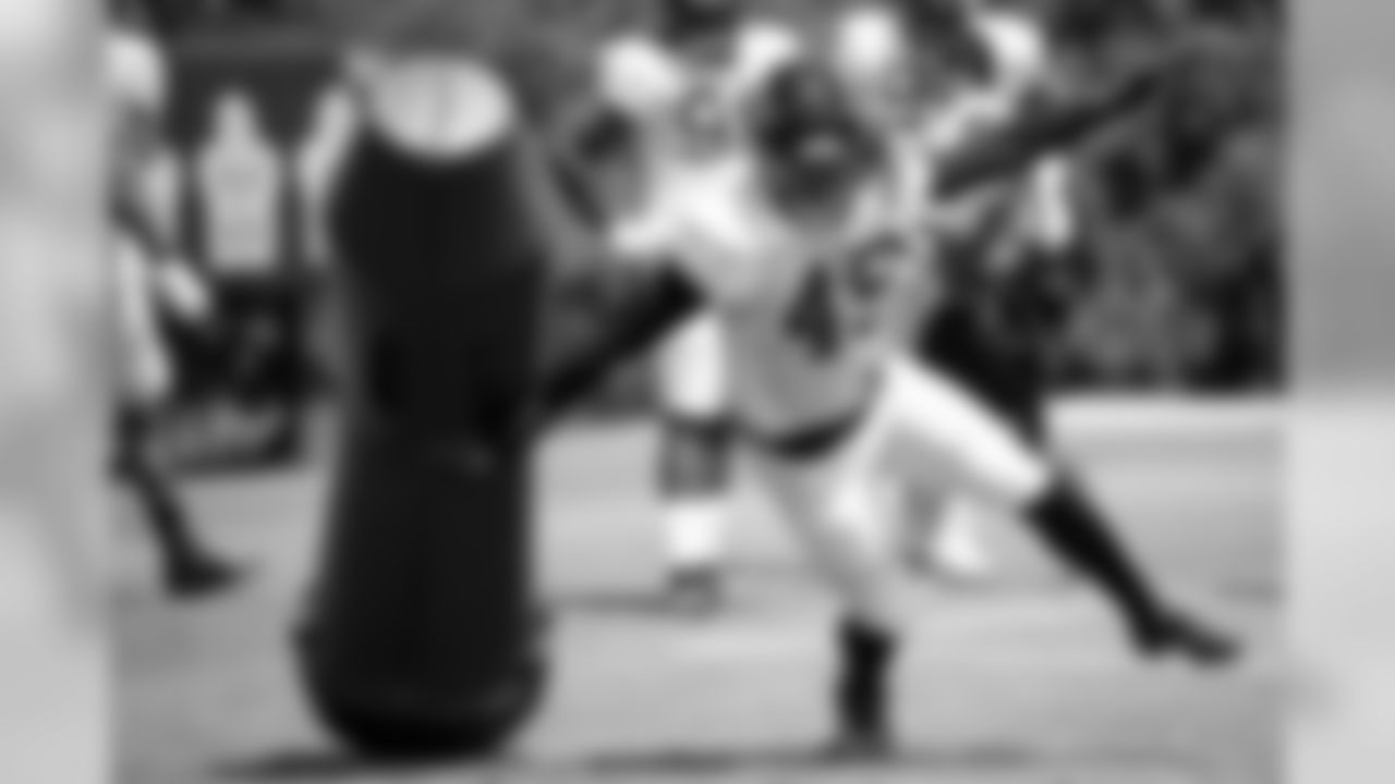 Atlanta Falcons linebacker Tre' Crawford #49 runs a drill during practice. (Photo by Kara Durrette/Atlanta Falcons).
